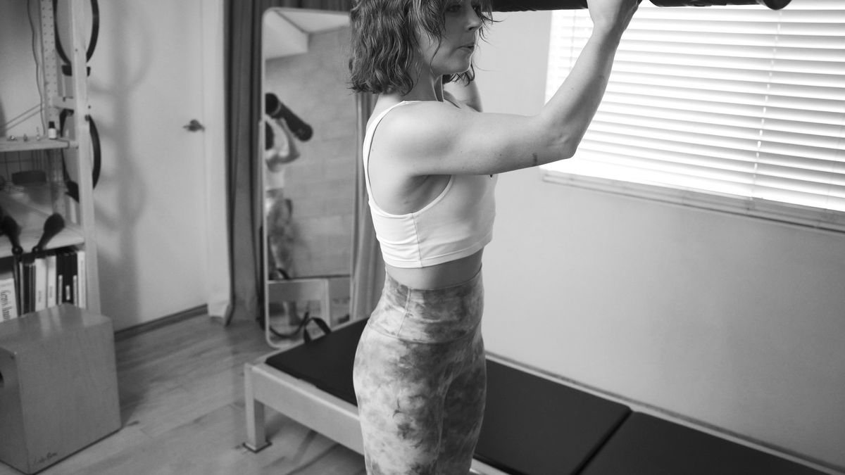 A person performing an exercise designed to improve functional movement and strength.